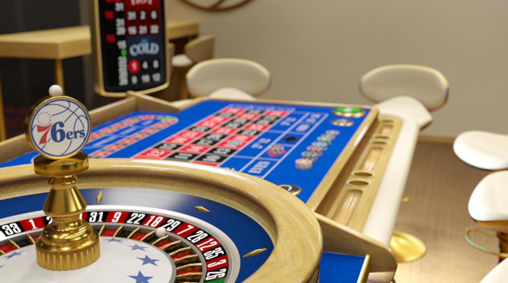 a 76ers-theed roulette wheel and table are seen in the basketball team's blue, white, and red color scheme with the logo on top of the wheel. BetMGM is launching Philadelphia 76ers-Themed live dealer Roulette & Blackjack on its online casino in PA and NJ